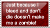 a stamp with a red backgound and white text saying just because i bleed and dont die doesnt make me a zombie!